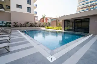 Квартира 1+1 с социальными удобствами в Махмутларе, в 450 м от моря · Фото 6