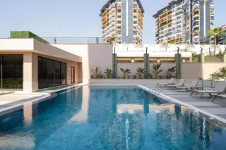 Квартира 1+1 с социальными удобствами в Махмутларе, в 450 м от моря · Фото 7