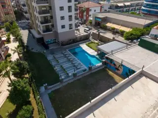 Квартира 1+1 с социальными удобствами в Махмутларе, в 450 м от моря · Фото 9