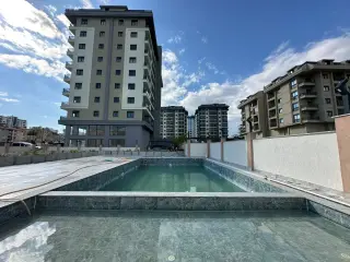 Квартира 2+1 с видом на юг в Махмутлар, в 600 м от моря · Фото 2